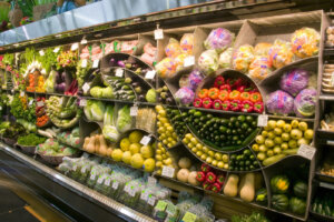 wall of produce at newport ave market in Bend