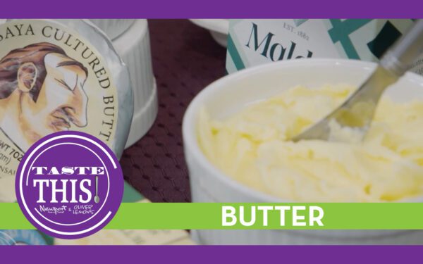 A close-up of a white dish filled with softened butter with a utensil inside, surrounded by packaged cultured butter products. A purple and green “Taste This” graphic banner runs across the bottom with the word “BUTTER.”